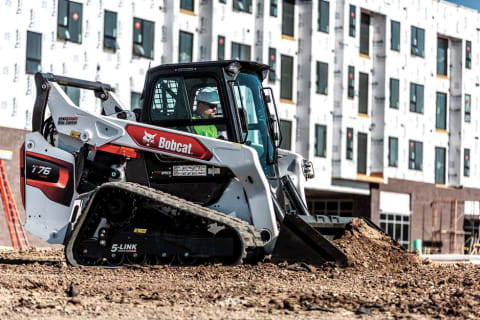 Bobcat T76 pushing dirt on a construction site