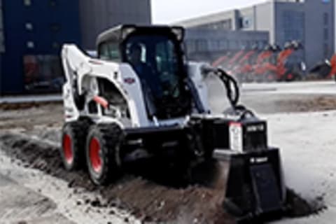 Bobcat S770 Skid-Steer Loader with wheel saw road ditching