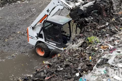 Bobcat S16 Skid-Steer Loader with bucket handling waste management