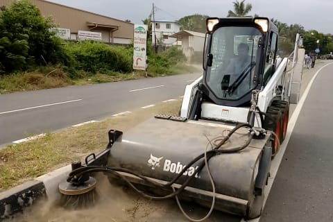 Bobcat Skid-Steer Loader with sweeper attachment