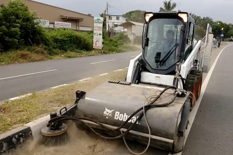 Bobcat Skid-Steer Loader with sweeper attachment