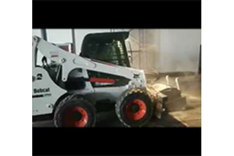 Bobcat Skid-Steer Loader roughening a concrete surface