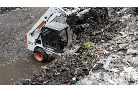 Bobcat S16 Skid-Steer Loader with bucket handling waste management