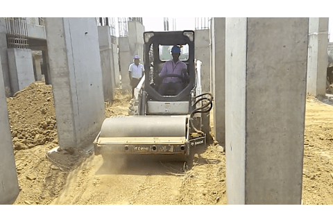 Homeowner driving a Bobcat S16 Skid-Steer with vibratory roller