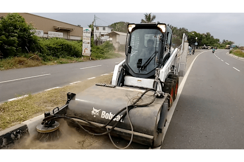 Bobcat Skid-Steer Loader with sweeper attachment